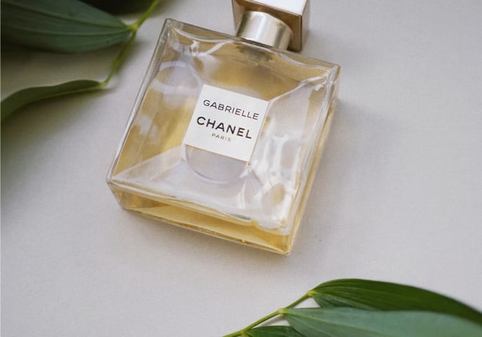 Gabrielle Chanel Parfume bottle laying on a surface.